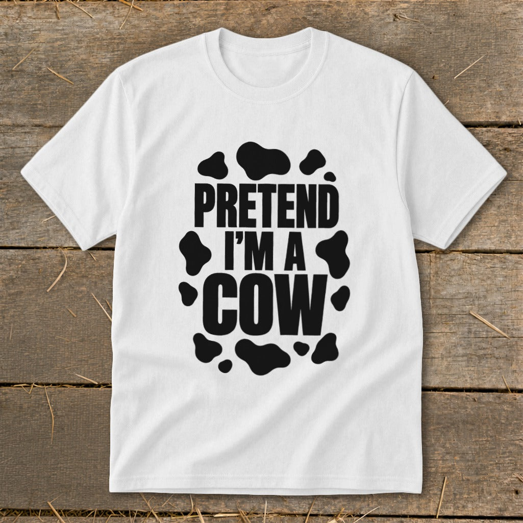 White t-shirt with black text that reads "PRETEND I'M A COW" and cow spots.