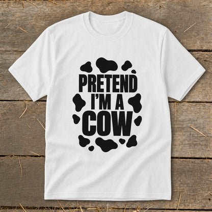White t-shirt with black text that reads "PRETEND I'M A COW" and cow spots.