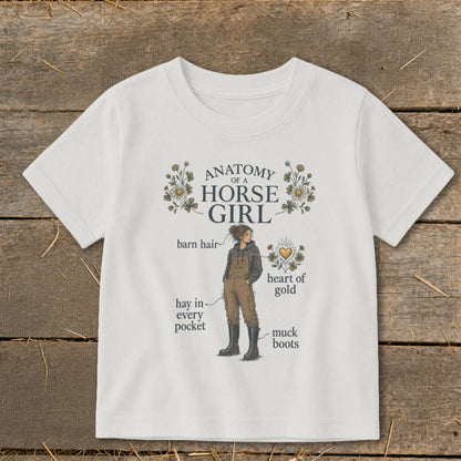 White t-shirt with "Anatomy of a Horse Girl" graphic and humorous labels.