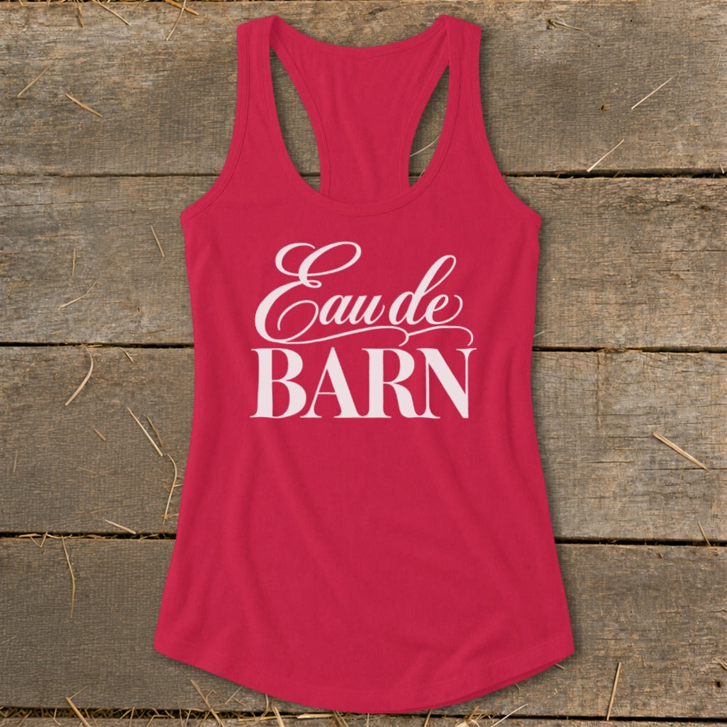 Pink racerback tank top with white text "Eau de BARN"