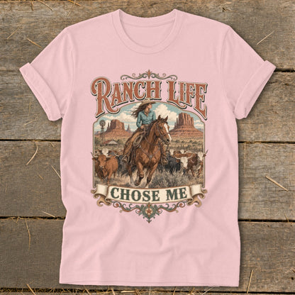 Pink t-shirt with "RANCH LIFE CHOSE ME" text and a cowgirl on horseback with cattle.