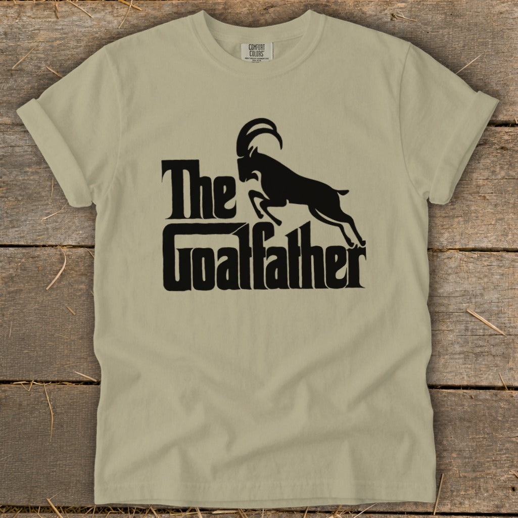 Light tan t-shirt with black "The Goatfather" text and goat silhouette.