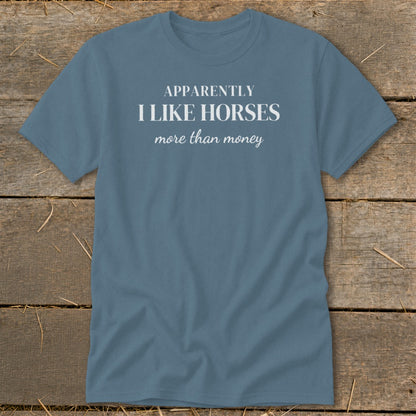 Blue t-shirt with "Apparently I like horses more than money" text