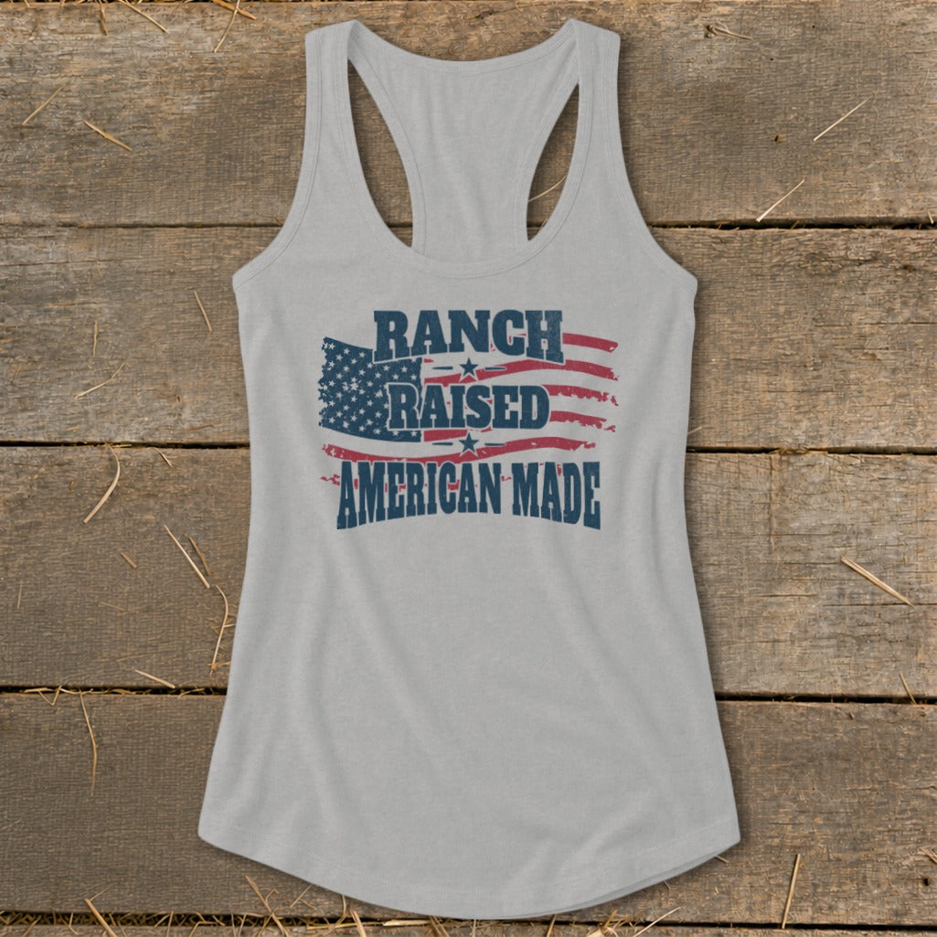 Grey tank top with distressed American flag and text "Ranch Raised American Made."