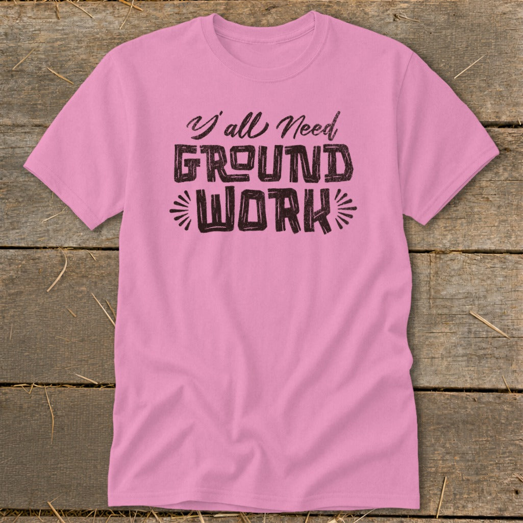 Pink t-shirt with "Y'all Need GROUND WORK" text.
