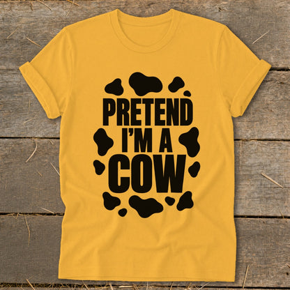 Yellow t-shirt with black text "PRETEND I'M A COW" and cow spots.