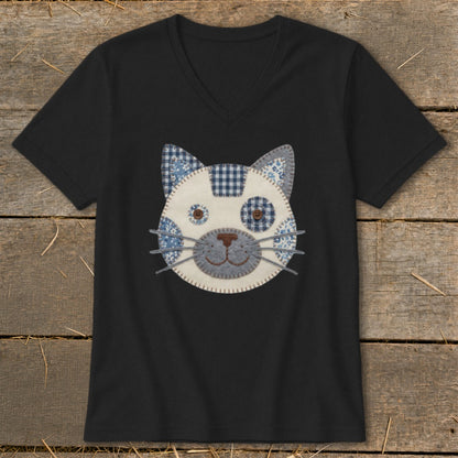 Black v-neck t-shirt with a patchwork cat face applique and button eyes.