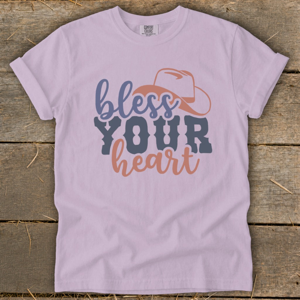 Light purple t-shirt with "bless YOUR heart" text and a cowboy hat graphic.