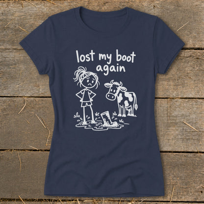 Navy blue women's t-shirt featuring a white graphic of a girl, a cow, and the text lost my boot again.