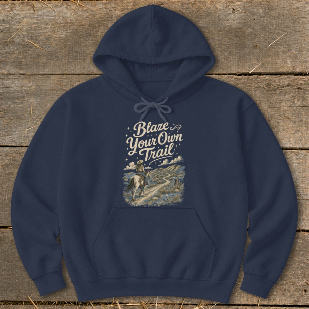 Navy hoodie with a graphic of a cowboy riding a horse on a trail with text "Blaze Your Own Trail".