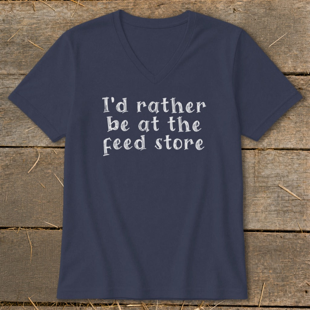 Navy v-neck t-shirt with white text reading "I'd rather be at the feed store."