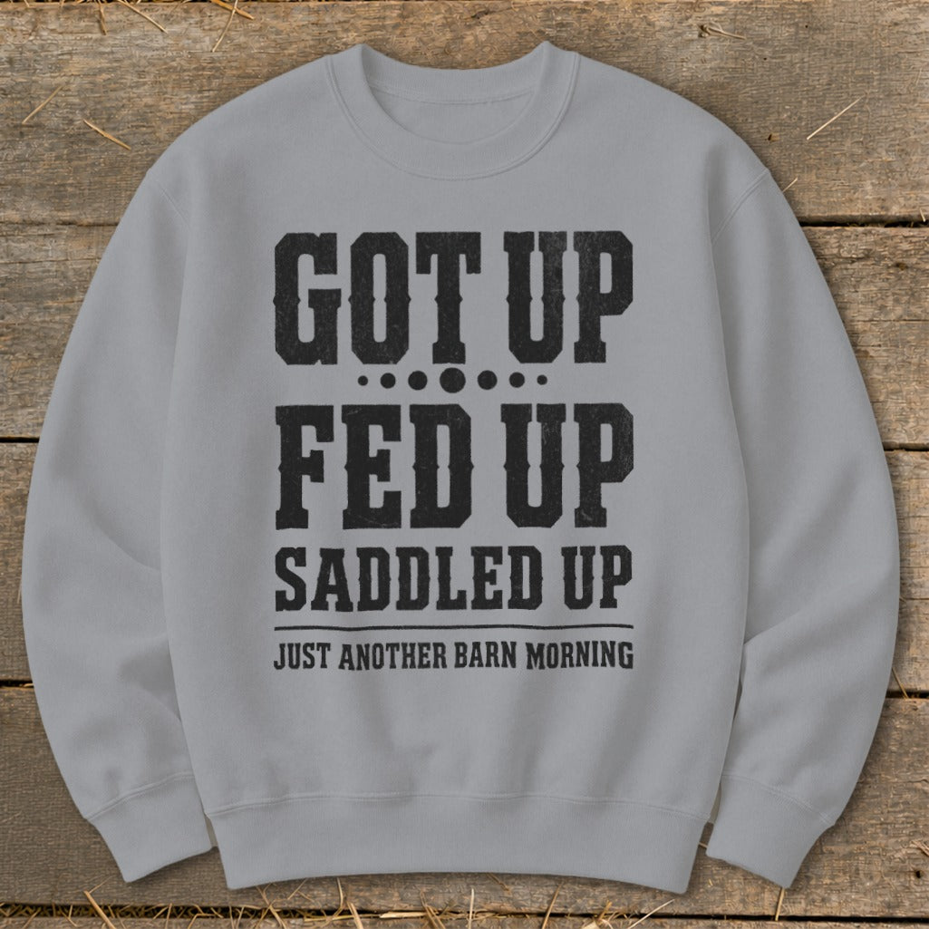 Light gray sweatshirt with black text: "GOT UP FED UP SADDLED UP JUST ANOTHER BARN MORNING".