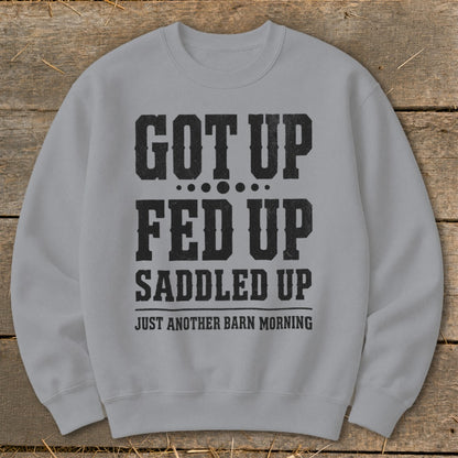Light gray sweatshirt with black text: "GOT UP FED UP SADDLED UP JUST ANOTHER BARN MORNING".