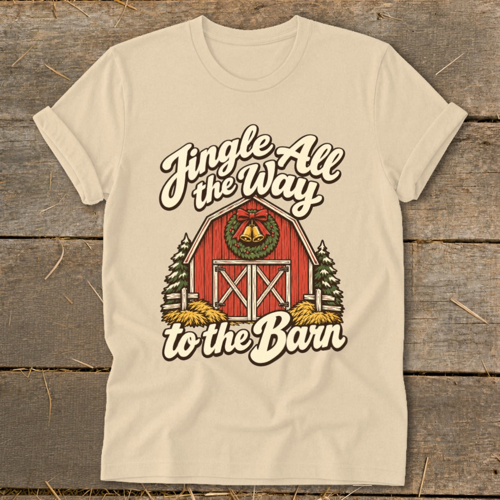 Christmas barn graphic with "Jingle All the Way to the Barn" text on a tan shirt.