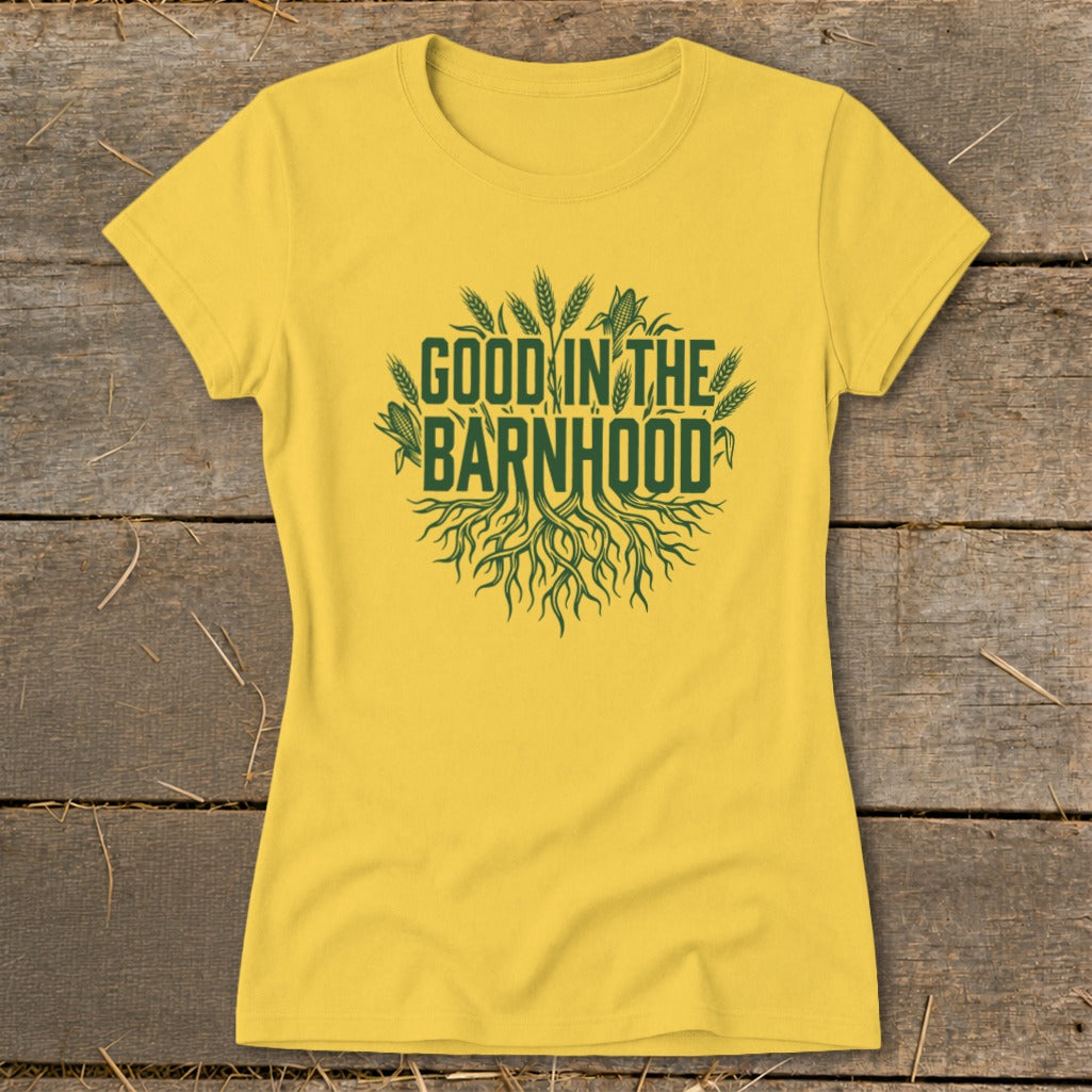 Yellow t-shirt with green text and imagery of roots and crops.