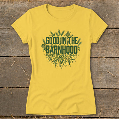 Yellow t-shirt with green text and imagery of roots and crops.