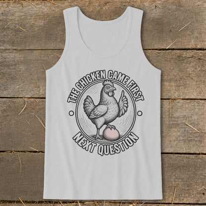 Light grey tank top with a graphic of a chicken on an egg and text saying "The chicken came first, next question."