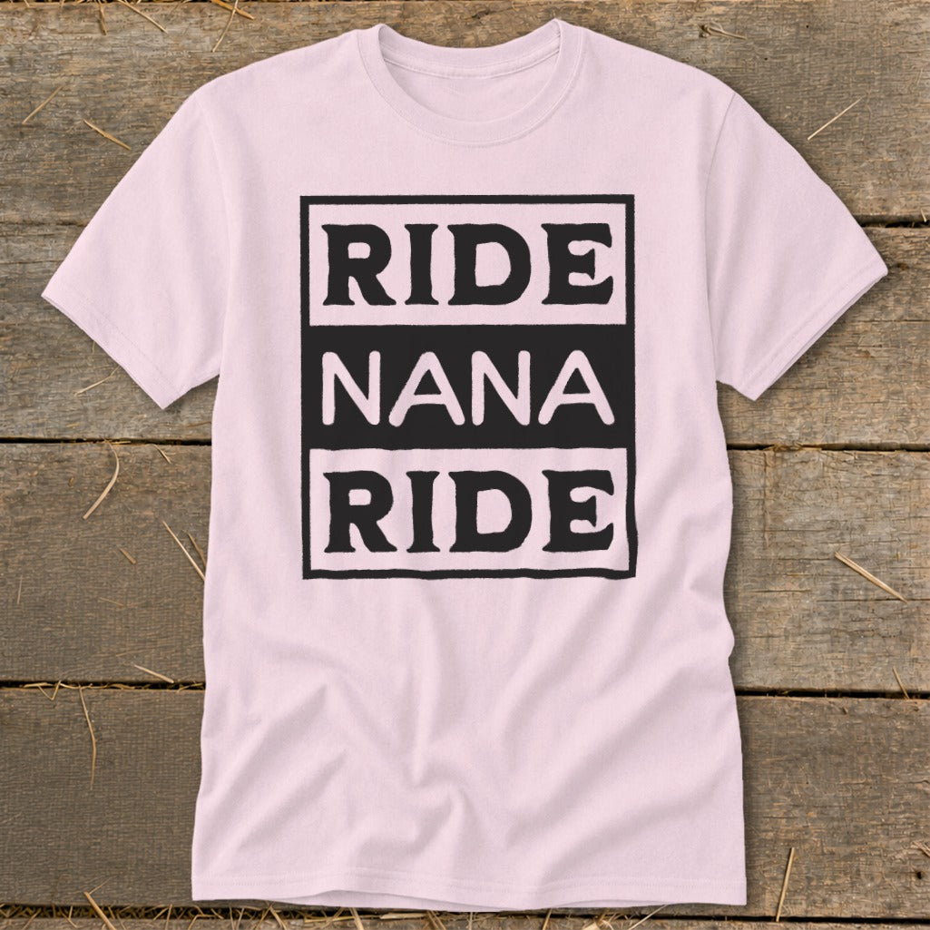 Pink t-shirt with black text reading "RIDE NANA RIDE" in stacked boxes.