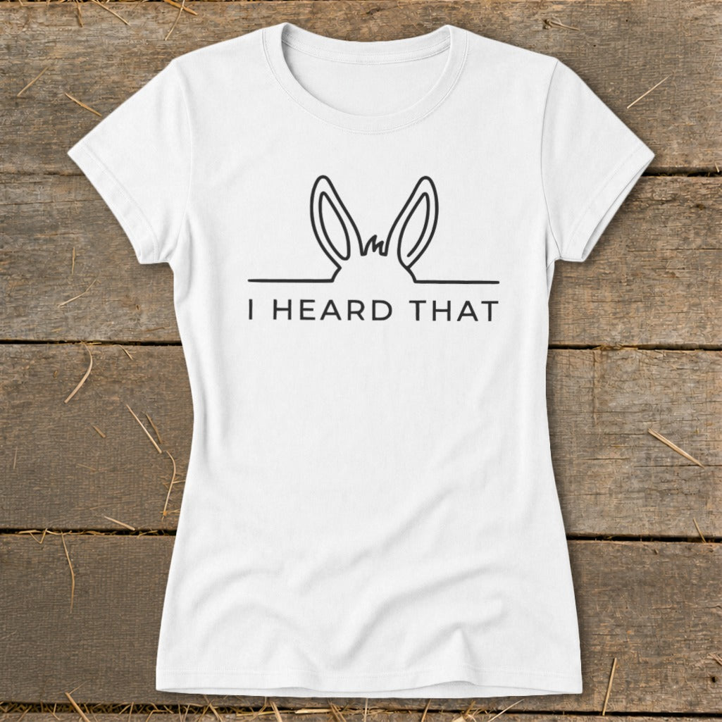 White t-shirt with black line drawing of donkey ears and "I HEARD THAT" text.
