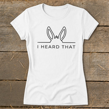 White t-shirt with black line drawing of donkey ears and "I HEARD THAT" text.