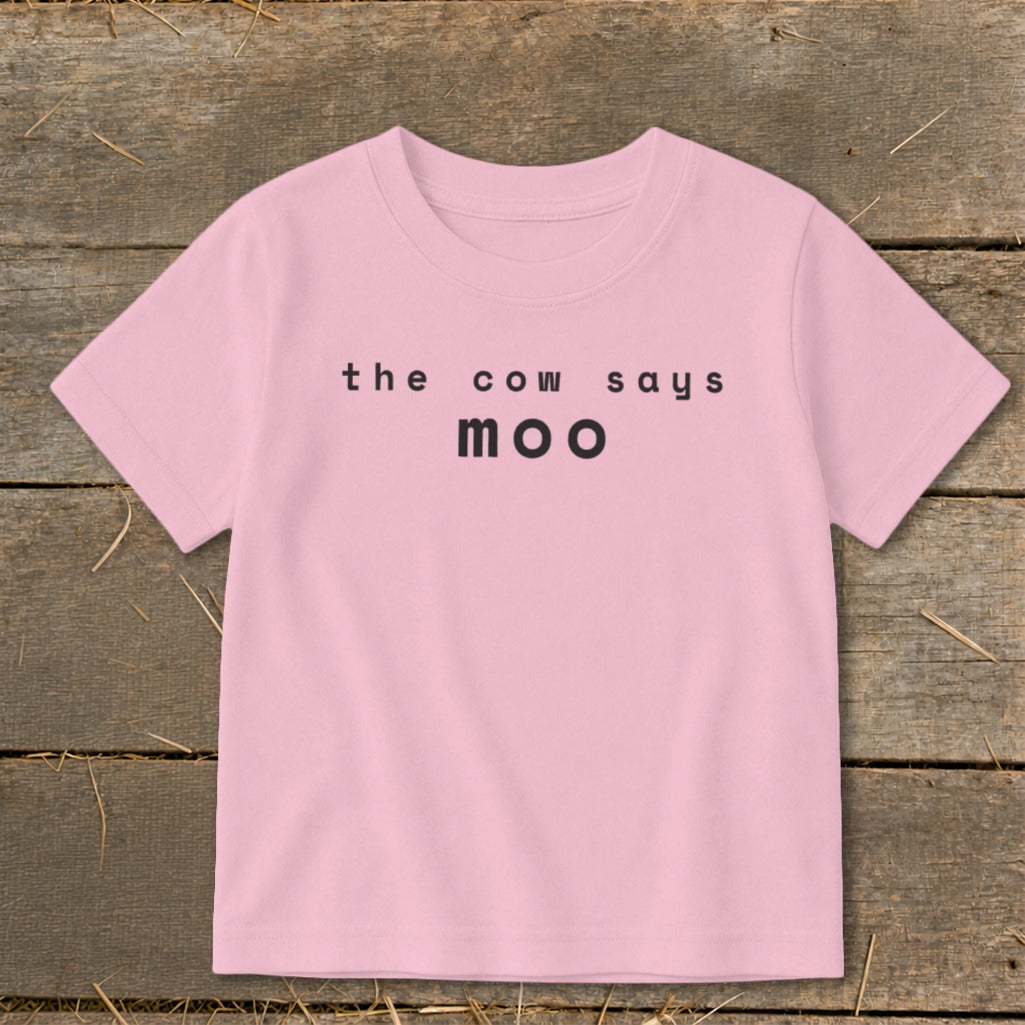 Pink t-shirt with black text that says "the cow says moo".