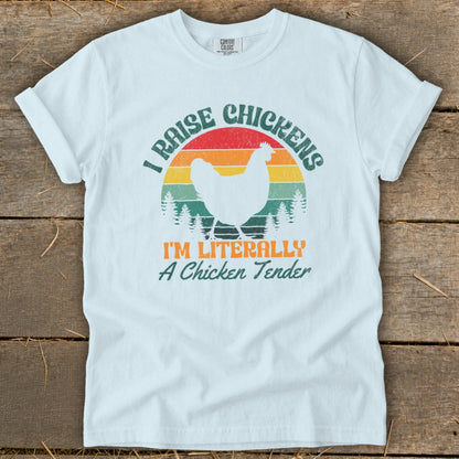 White t-shirt with retro design featuring a chicken, sunset, and text.