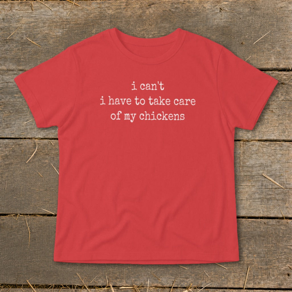 Red t-shirt with white text that reads "i can't i have to take care of my chickens".