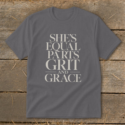 Grey t-shirt with text "SHE'S EQUAL PARTS GRIT AND GRACE".