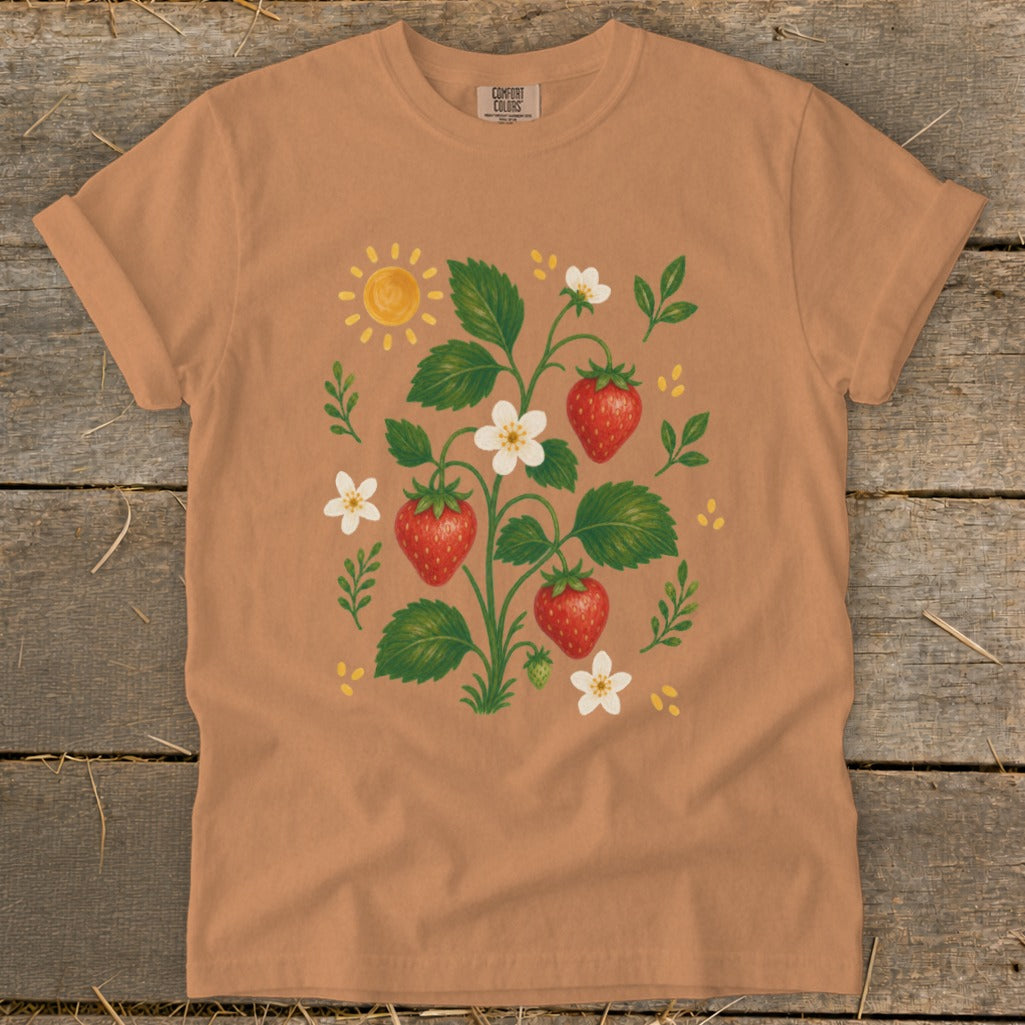 T-shirt with a strawberry plant illustration and a smiling sun graphic.