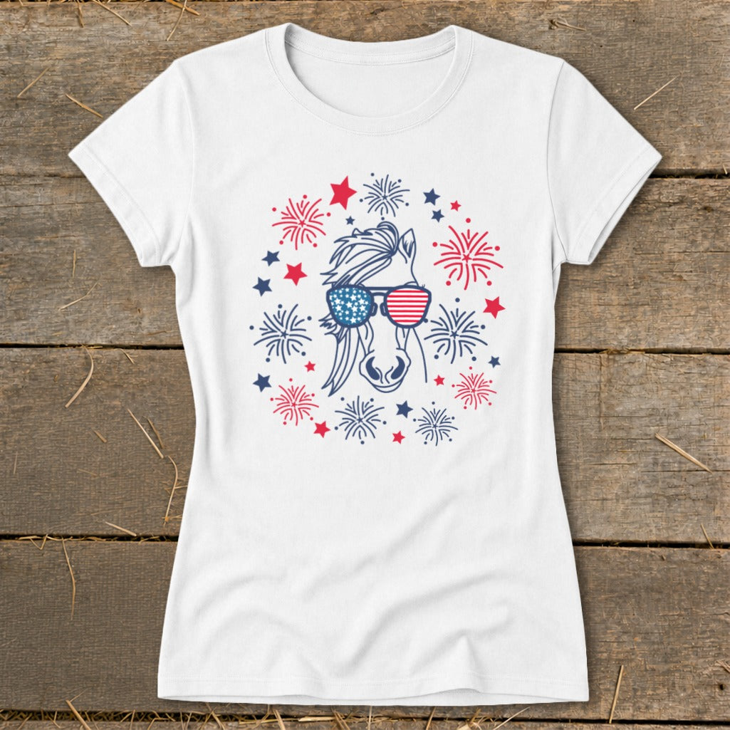 White t-shirt featuring a horse head wearing American flag sunglasses surrounded by fireworks.