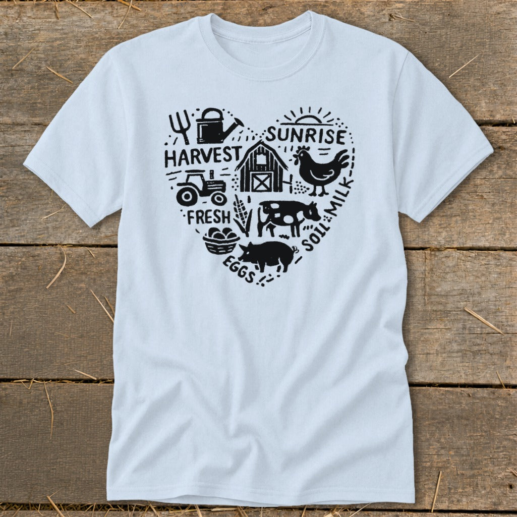 Light blue t-shirt with black heart-shaped farm graphic including tractor, barn, animals, and text.