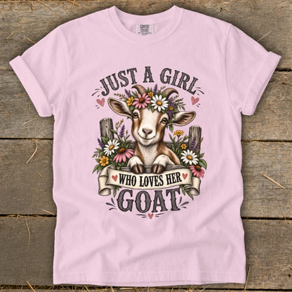 Pink t-shirt with goat wearing flowers and text "Just a Girl Who Loves Her Goat."