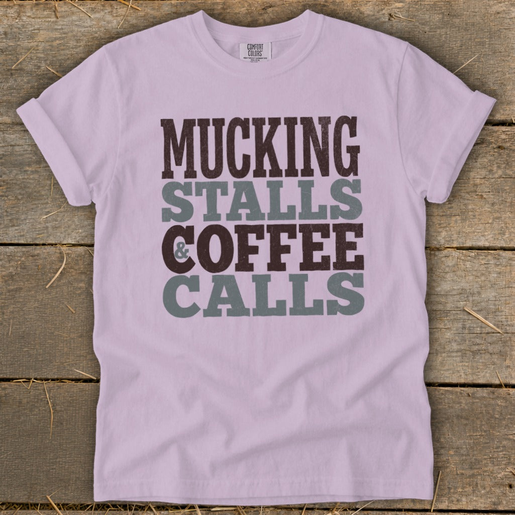 Purple Comfort Colors t-shirt with "MUCKING STALLS & COFFEE CALLS" text.