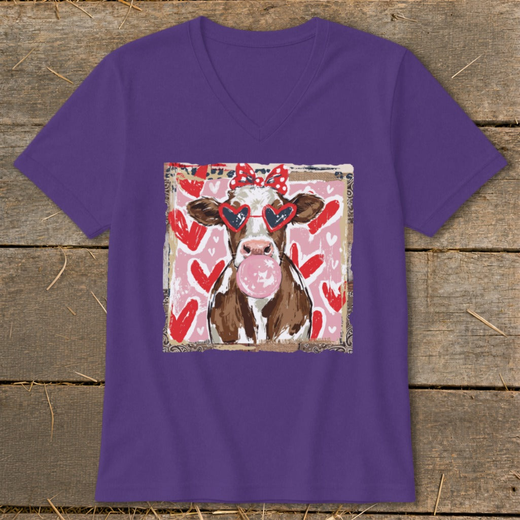 Cow with heart sunglasses and bubblegum on pink and red heart background.