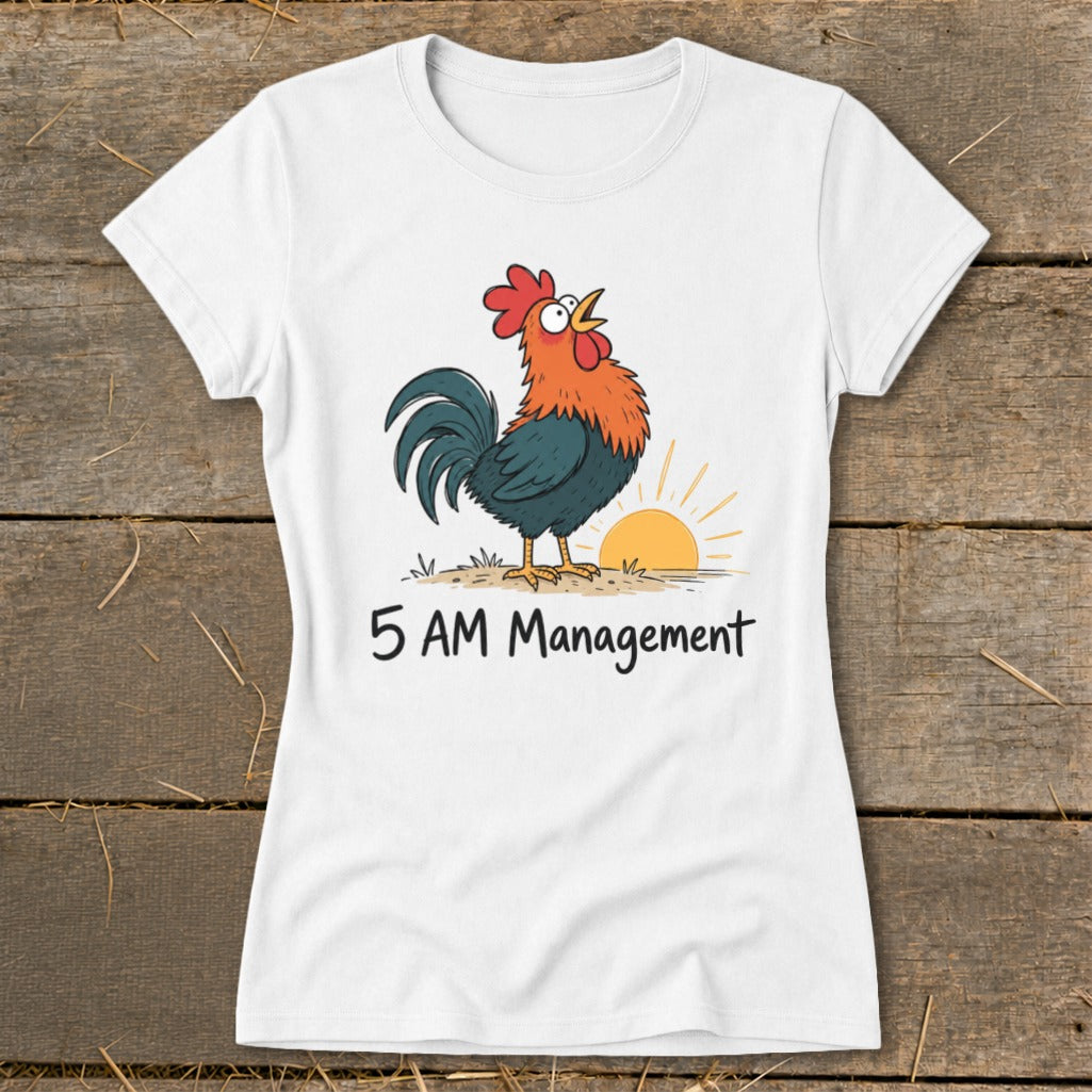White t-shirt with a cartoon rooster crowing at sunrise and text "5 AM Management".