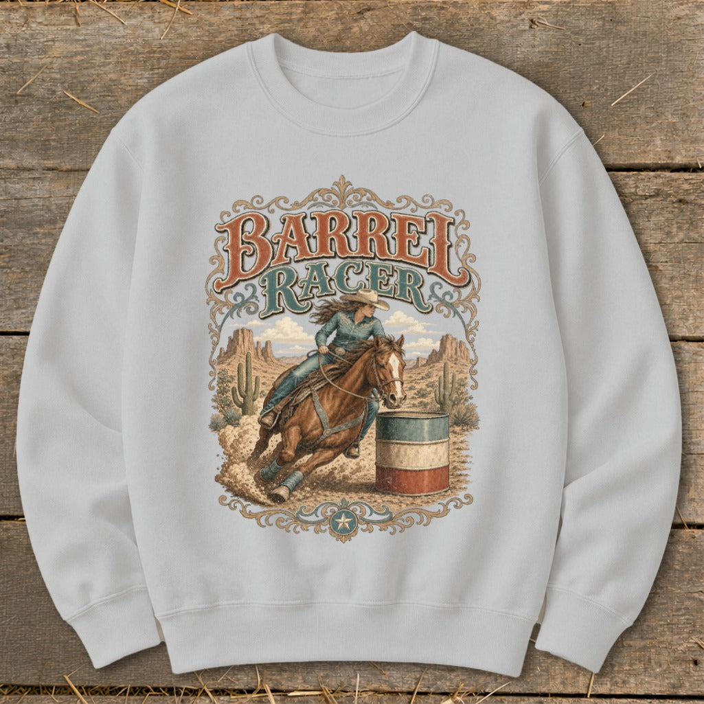 White sweatshirt with a barrel racer on horseback in a desert landscape.