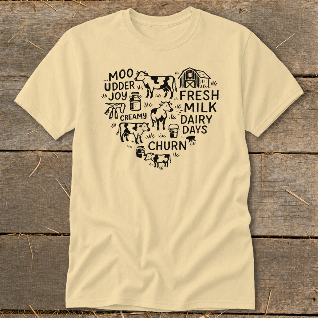 Cream t-shirt with black farm heart graphic featuring cows, milk jug, and text.