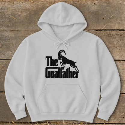 White hoodie with black "The Goalfather" text and a leaping goat graphic.
