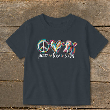 Dark gray t-shirt with peace sign, heart, and cow graphic with text.