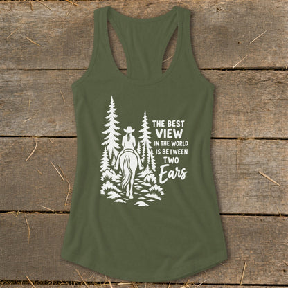 An olive green racerback tank top with a white graphic of a person on horseback among trees and the text The Best View in the World is Between Two Ears.