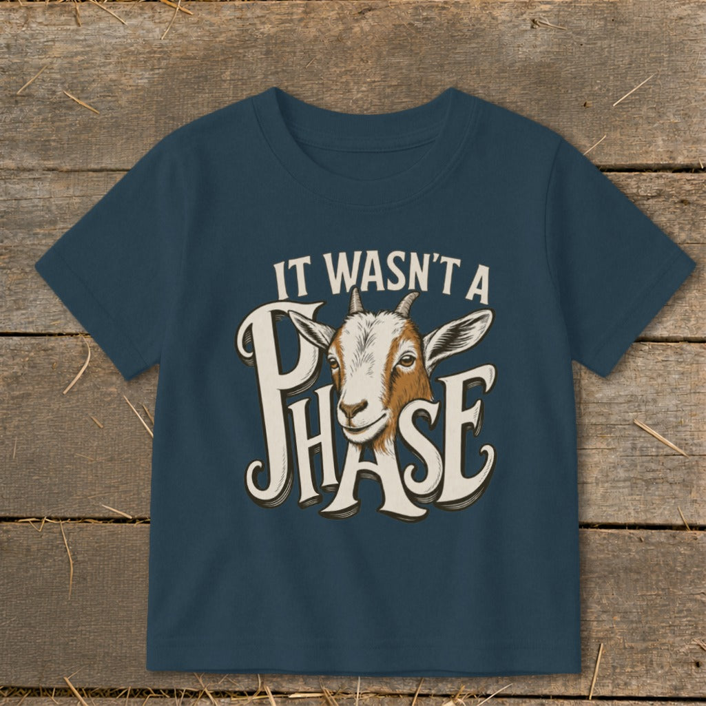 Navy t-shirt with graphic of a goat and text "IT WASN'T A PHASE".