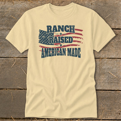 Cream t-shirt with American flag graphic and text "RANCH RAISED AMERICAN MADE".