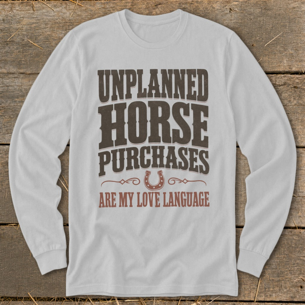 White long-sleeve shirt with "Unplanned Horse Purchases Are My Love Language" text.