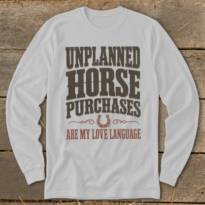 White long-sleeve shirt with "Unplanned Horse Purchases Are My Love Language" text.