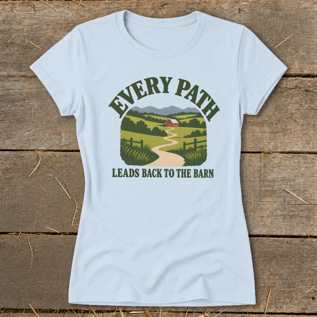 Light blue t-shirt with text "Every Path Leads Back to the Barn" and farm landscape graphic.