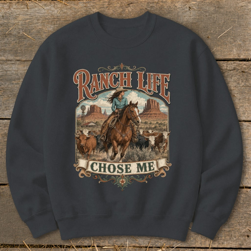 Ranch Life Chose Me graphic on dark gray sweatshirt with cowboy on horse and cattle.