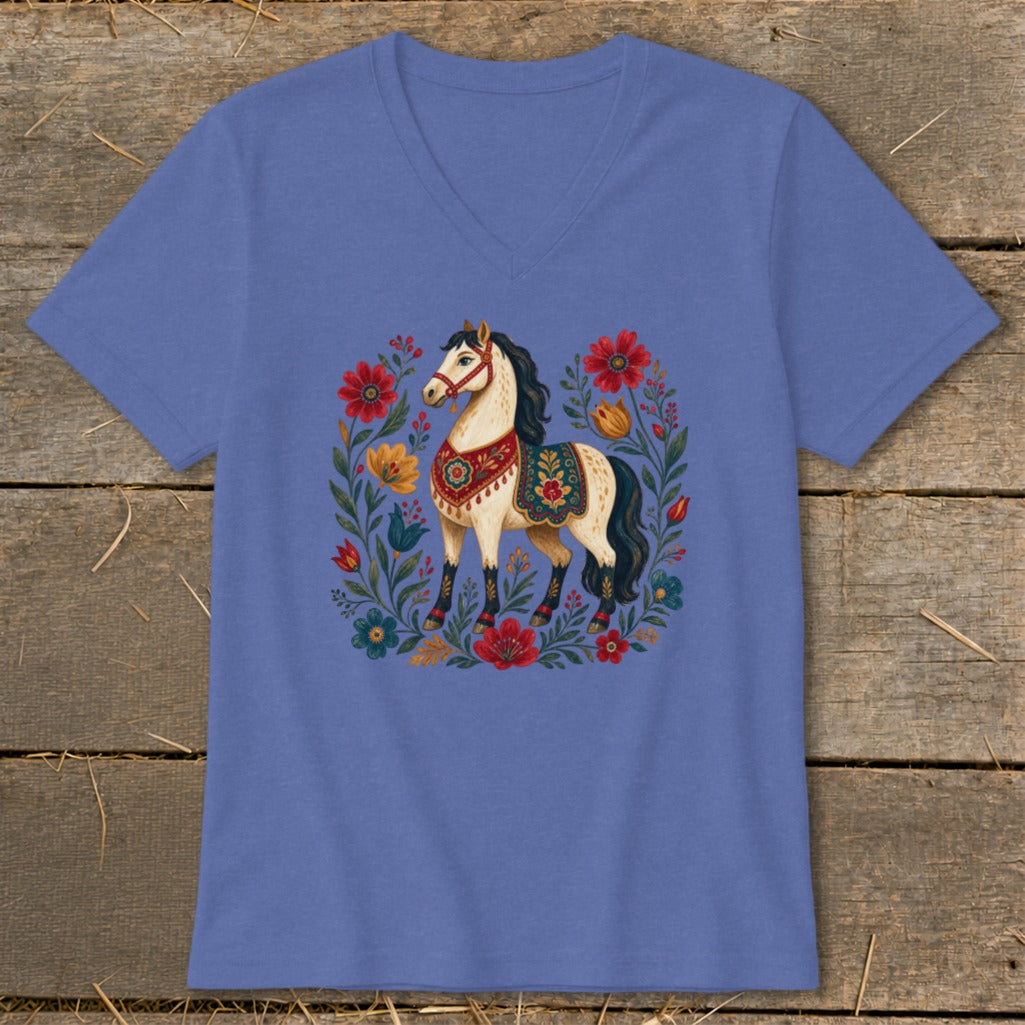 Blue t-shirt with a cream-colored horse and colorful floral wreath design.