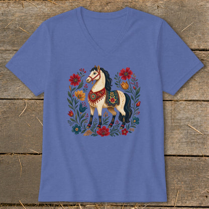 Blue t-shirt with a cream-colored horse and colorful floral wreath design.