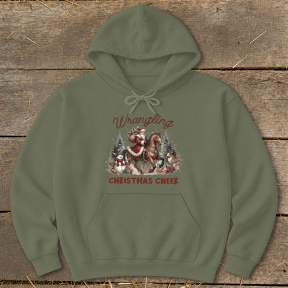 Green hoodie with a Christmas graphic of Santa riding a horse, with snowmen and reindeer.