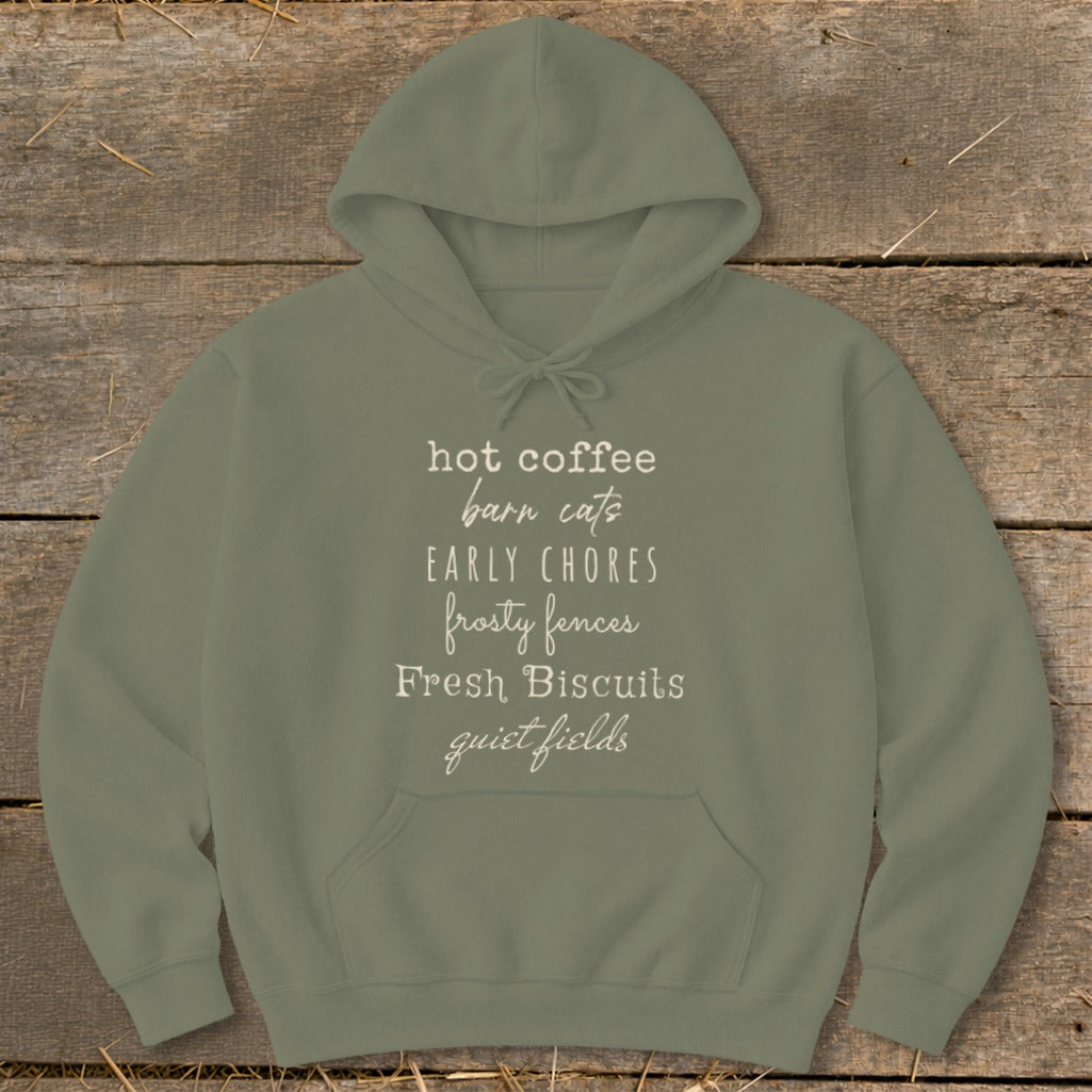 Olive green hoodie with "hot coffee barn cats early chores frosty fences fresh biscuits quiet fields" text.